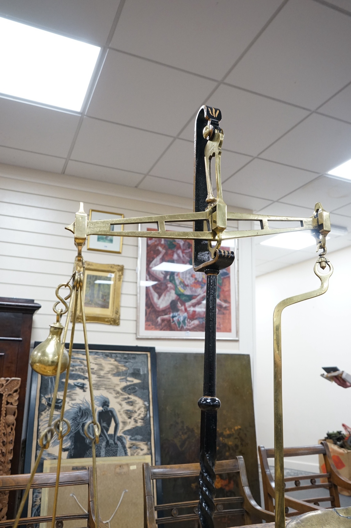 A brass Beam scale, on cast iron stand, W & T Avery, 95cm high. Condition - fair